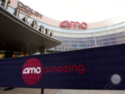 FILE - This Jan. 29, 2021, file photo, shows an AMC movie cinema in Garland, Texas. GameStop and other meme stocks, such as AMC, are soaring again. Much of professional Wall Street said earlier in the year that the phenomenon would likely fizzle out in time, particularly after the smaller-pocketed and novice investors behind it felt the pain of losing their money. AMC Entertainment has set records recently. (AP Photo/LM Otero, File)