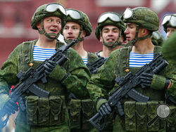 FILE - In this May 9, 2021, file photo, Russian paratroopers march the Victory Day military parade in Red Square in Moscow, Russia, marking the 76th anniversary of the end of World War II in Europe. Earlier this year, Russia bolstered its forces near Ukraine and warned Kyiv that it could intervene militarily if Ukrainian authorities try to retake the rebel-controlled east. Moscow also has bristled at NATO’s joint drills with Ukraine, saying they reflect the alliance’s aggressive intentions. (AP Photo/Alexan