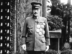 In this undated photo, former Japan's Prime Minister General Hideki Tojo is shown with medals outside of the Diet. The declassified U.S. military documents show the ashes of seven executed war criminals, including wartime Prime Minister Tojo, were scattered at sea off Yokohama from a U.S. army plane. (AP Photo/Charles Gorry)