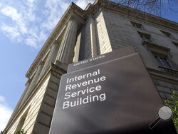 FILE - In this photo March 22, 2013, file photo, the exterior of the Internal Revenue Service (IRS) building in Washington. As ransomware attacks surge, the FBI is doubling down on its guidance to affected businesses: Don't pay the cybercriminals. But the U.S. government also offers a little-noticed incentive for those who do pay: The ransoms may be tax deductible. (AP Photo/Susan Walsh, File)