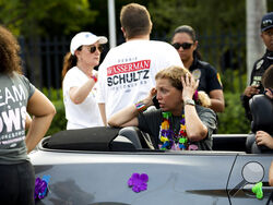 Rep. Debbie Wasserman Schultz, D-Fla., makes a call after a truck drove into a crowd of people during The Stonewall Pride Parade and Street Festival in Wilton Manors, Fla., Saturday, June 19, 2021. A driver has slammed into spectators at the start of a Pride parade in South Florida, injuring at least two people. (Chris Day/South Florida Sun-Sentinel via AP)