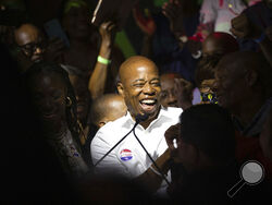 Mayoral candidate Eric Adams mingles with supporters during his election night party, late Tuesday, June 22, 2021, in New York. (AP Photo/Kevin Hagen)