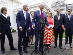 President Joe Biden, with a bipartisan group of senators, speaks Thursday June 24, 2021, outside the White House in Washington. Biden invited members of the group of 21 Republican and Democratic senators to discuss the infrastructure plan. From left are, Sen. Jeanne Shaheen, D-N.H., Sen. Rob Portman, R-Ohio, Sen. Bill Cassidy, R-La., Sen. Lisa Murkowski, R-Alaska, Biden, Sen, Joe Manchin, D-W.Va., Sen. Kyrsten Sinema, D-Ariz, Sen. Mark Warner, D-Va., and Sen. Mitt Romney, R-Utah. (AP Photo/Jacquelyn Martin)