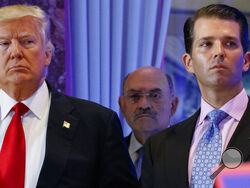 FILE - This file photo from Wednesday Jan. 11, 2017, shows President-elect Donald Trump, left, his chief financial officer Allen Weisselberg, center, and his son Donald Trump Jr., right, during a news conference at Trump Tower in New York. Prosecutors in New York are expected to bring the first criminal charges in a two-year investigation into Trump's business practices, accusing his namesake company and its longtime finance chief Weisselberg of tax crimes. (AP Photo/Evan Vucci, File)