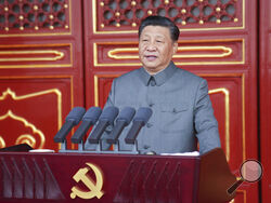 In this photo provided by China's Xinhua News Agency, Chinese President and party leader Xi Jinping delivers a speech at a ceremony marking the centenary of the ruling Communist Party in Beijing, China, Thursday, July 1, 2021. China’s Communist Party is marking the 100th anniversary of its founding with speeches and grand displays intended to showcase economic progress and social stability to justify its iron grip on political power that it shows no intention of relaxing. (Li Xueren/Xinhua via AP)