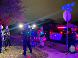 In this photo on Twitter released by the Fort Worth Police, Fort Worth Police Chief Neil Noakes holds a news briefing at the site of a shooting early Sunday, July 4, 2021, in Fort Worth, Texas. Multiple people were wounded early Sunday in a shooting near a Fort Worth car wash in which it appears multiple guns were used, police said. (Fort Worth Police Dept. via AP)