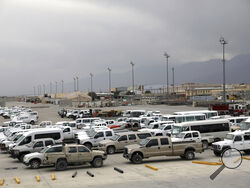 Vehicles are parked at Bagram Airfield after the American military left the base, in Parwan province north of Kabul, Afghanistan, Monday, July 5, 2021. The U.S. left Afghanistan's Bagram Airfield after nearly 20 years, winding up its "forever war," in the night, without notifying the new Afghan commander until more than two hours after they slipped away. (AP Photo/Rahmat Gul)