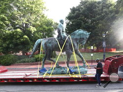 The monument of Robert E. Lee is removed on Saturday, July 10, 2021 in Charlottesville, Va. The removal of the Lee and Jackson statues comes nearly four years after violence erupted at the infamous “Unite the Right” rally. (Erin Edgerton/The Daily Progress via AP)