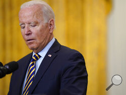 FILE - In this July 8, 2021, file photo President Joe Biden pauses as he speaks about the American troop withdrawal from Afghanistan, in the East Room of the White House in Washington. President Joe Biden speaks volumes when he whispers. And his whispers during recent public appearances are attracting attention. The White House and communications experts say it's Biden's way of trying to make a connection while emphasizing a point. (AP Photo/Evan Vucci, File)