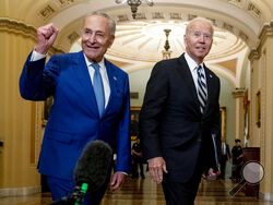 President Joe Biden joins Senate Majority Leader Chuck Schumer, D-N.Y., and fellow Democrats at the Capitol in Washington, Wednesday, July 14, 2021, to discuss the latest progress on his infrastructure agenda. (AP Photo/Andrew Harnik)