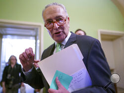 Senate Majority Leader Chuck Schumer, D-N.Y., talks to reporters as he leaves a news conference at the Capitol in Washington, Thursday, July 15, 2021. Schumer is scheduling a procedural vote for next Wednesday to begin debate on a still-evolving bipartisan infrastructure bill. (AP Photo/J. Scott Applewhite)