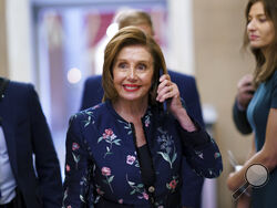 Speaker of the House Nancy Pelosi, D-Calif., returns to her office where members of the House select committee on the January 6th attack on the Capitol are preparing for the start of hearings next week, at the Capitol in Washington, Thursday, July 22, 2021. (AP Photo/J. Scott Applewhite)