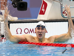 Chase Kalisz, of the United States, celebrates after winning the final of the men's 400-meter individual medley at the 2020 Summer Olympics, Sunday, July 25, 2021, in Tokyo, Japan. (AP Photo/Martin Meissner)