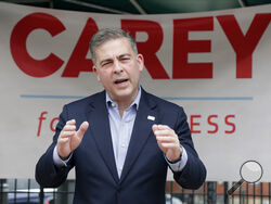 FILE - In this June 1, 2021, file photo, Mike Carey, speaks at the kick-off of his 15th Congressional District campaign in Grove City, Ohio. Former President Donald Trump has endorsed Carey, a coal lobbyist who is among 10 Republicans jockeying to replace former GOP Rep. Steve Stivers, who retired from Congress earlier this year.(Barbara J. Perenic/Columbus Dispatch via AP, File)