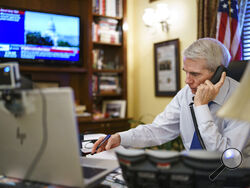 Sen. Rob Portman, R-Ohio, the top Republican negotiator on the bipartisan infrastructure bill, works from his office on Capitol Hill as he continues to shepherd the $1 trillion legislation closer to passage, in Washington, Monday, Aug. 9, 2021. (AP Photo/J. Scott Applewhite)