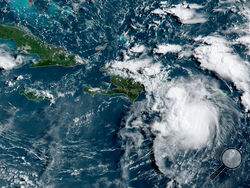 This satellite image provided by the National Oceanic and Atmospheric Administration (NOAA) shows a Tropical Storm Fred in the Caribbean as it passes south of Puerto Rico and the Dominican Republic at 8am EST, Wednesday, Aug. 11, 2021. (NOAA/NESDIS/STAR GOES via AP)