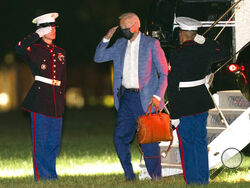 President Joe Biden arrives at Fort Lesley J. McNair in Washington from Camp David retreat, Tuesday, Aug. 17, 2021. (AP Photo/Manuel Balce Ceneta)