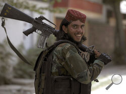 A Taliban fighter patrols in Wazir Akbar Khan in the city of Kabul, Afghanistan, Wednesday, Aug. 18, 2021. The Taliban declared an "amnesty" across Afghanistan and urged women to join their government Tuesday, seeking to convince a wary population that they have changed a day after deadly chaos gripped the main airport as desperate crowds tried to flee the country. (AP Photo/Rahmat Gul)