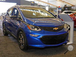 FILE - This Thursday, Feb. 13, 2020 file photo shows a 2020 Chevrolet Bolt EV on display at the 2020 Pittsburgh International Auto Show in Pittsburgh. General Motors is recalling all Chevrolet Bolt electric vehicles sold worldwide to fix a battery problem that could cause fires. The recall raises questions about lithium ion batteries, which now are used in nearly all electric vehicles. President Joe Biden wants to convert 50% of the U.S. vehicle fleet from internal combustion to electricity by 2050 as part 