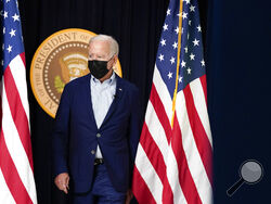 President Joe Biden arrives to attend a FEMA briefing on Hurricane Ida in the South Court Auditorium in the Eisenhower Executive Office Building on the White House Campus, Saturday, Aug. 28, 2021, in Washington. (AP Photo/Manuel Balce Ceneta)