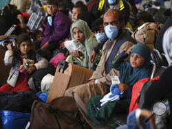 Afghan refugees are processed inside Hangar 5 at the Ramstein U.S. Air Base in Germany Wednesday, Sept. 8, 2021. U.S. Secretary of State Antony Blinken arrived at the base where he will meet with his German counterpart for talks on Afghanistan. (Olivier Douliery/Pool Photo via AP)