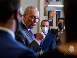 Senate Majority Leader Chuck Schumer, D-N.Y., speaks to reporters as work continues on the Democrats' Build Back Better Act, massive legislation that is a cornerstone of President Joe Biden's domestic agenda, at the Capitol, in Washington, Tuesday, Sept. 14, 2021. (AP Photo/Andrew Harnik)
