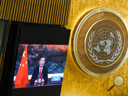 China's President Xi Jinping remotely addresses the 76th session of the United Nations General Assembly in a pre-recorded message, Tuesday Sept. 21, 2021, at UN headquarters.(AP Photo/Mary Altaffer, Pool)