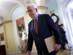 Senate Minority Leader Mitch McConnell, R-Ky., walks to the chamber for a test vote on a government spending bill, at the Capitol in Washington, Monday, Sept. 27, 2021. (AP Photo/J. Scott Applewhite)
