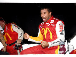 Bubba Wallace reacts after he is pronounced the winner while waiting out a rain delay before which he was the leader during a NASCAR Cup series auto race Monday, Oct. 4, 2021, in Talladega, Ala. (AP Photo/John Amis)
