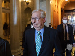 Senate Minority Leader Mitch McConnell of Ky., walks to a policy luncheon on Capitol Hill, Thursday, Oct. 7, 2021, in Washington. (AP Photo/Alex Brandon)