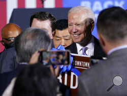 President Joe Biden greets people after speaking about his infrastructure plan and his domestic agenda during a visit to the Electric City Trolley Museum in Scranton, Pa., Wednesday, Oct. 20, 2021. (AP Photo/Susan Walsh)