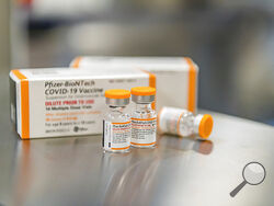 This October 2021 photo provided by Pfizer shows kid-size doses of its COVID-19 vaccine in Puurs, Belgium. The vaccine appear safe and nearly 91% effective at preventing symptomatic infections in 5- to 11-year-olds, according to study details released Friday, Oct. 22, as the U.S. considers opening vaccinations to that age group. (Pfizer via AP)