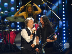 Paul McCartney and Dave Grohl perform during the Rock & Roll Hall of Fame induction ceremony, Sunday, Oct. 31, 2021, in Cleveland. (AP Photo/David Richard)