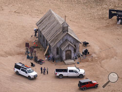 FILE - This aerial photo shows the Bonanza Creek Ranch in Santa Fe, N.M., on Saturday, Oct. 23, 2021. The person in charge of weapons on the movie set at the ranch where actor Alec Baldwin fatally shot cinematographer Halyna Hutchins said Wednesday night, Nov. 3 that she suspects someone put in a live bullet in the prop gun that Baldwin shot. (AP Photo/Jae C. Hong, File)