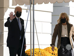 President Joe Biden, and first lady Jill Biden walk to board Marine One on the South Lawn of the White House in Washington, Saturday, Nov. 6, 2021. Biden is spending the weekend at his home in Rehoboth Beach, Del. (AP Photo/Alex Brandon)
