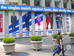 FILE - A man walks past promotional posters outside Fox News studios at News Corporation headquarters in New York on Saturday, July 31, 2021. From left to right are hosts Tucker Carlson, Sean Hannity, Laura Ingraham, Maria Bartiromo, Stuart Varney, Neil Cavuto and Charles Payne. A study by the Kaiser Family Foundation says that people who trust Fox News Channel and other outlets that appeal to conservatives are more likely to believe COVID-19 falsehoods than those who go elsewhere for news. (AP Photo/Ted Sh