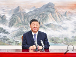 In this photo released by Xinhua News Agency, Chinese President Xi Jinping delivers a keynote speech for the Asia-Pacific Economic Cooperation (APEC) CEO Summit via video, from Beijing on Thursday, Nov. 11, 2021. Xi warned Thursday against letting tensions in the Asian-Pacific region cause a relapse into a Cold War mentality. (Li Xueren/Xinhua via AP)
