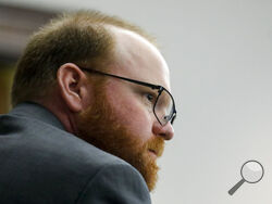 Defendant Travis McMichael looks on during during his trial at the Glynn County Courthouse, Friday, Nov. 19, 2021, in Brunswick, Ga. Greg McMichael and his son, Travis McMichael, and a neighbor, William "Roddie" Bryan are charged with the February 2020 slaying of 25-year-old Ahmaud Arbery. (Octavio Jones/Pool Photo via AP)