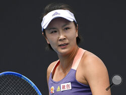 FILE - China's Peng Shuai reacts during her first round singles match against Japan's Nao Hibino at the Australian Open tennis championship in Melbourne, Australia on Jan. 21, 2020. IOC President Thomas Bach can't escape repeated questions about Peng and suspicions around two video calls the IOC has had with her. The questions keep coming. And Bach has acknowledged the situation is “fragile.” (AP Photo/Andy Brownbill, File)
