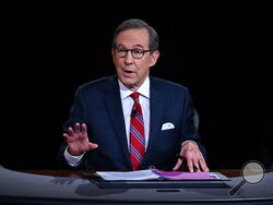 FILE - Moderator Chris Wallace of Fox News speaks as President Donald Trump and Democratic presidential candidate former Vice President Joe Biden participate in the first presidential debate in Cleveland on Sept. 29, 2020. Wallace says he's leaving the network after 18 years and is “ready for a new adventure.” Wallace made the announcement, Sunday, Dec. 12, 2021, at the end of the weekly news show he moderates, “Fox News Sunday.”(Olivier Douliery/Pool via AP, File)