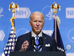 FILE - President Joe Biden speaks about the COVID-19 variant named omicron during a visit to the National Institutes of Health on Dec. 2, 2021, in Bethesda, Md. Biden plans to stress in a Dec. 21 speech the importance of getting vaccinated to protect from a wave of COVID-19 infections tied to the new omicron variant as Christmas approaches. (AP Photo/Evan Vucci, File)