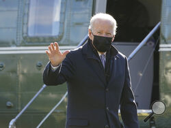 President Joe Biden walks to the Oval Office of the White House after stepping off Marine One, Monday, Jan. 10, 2022, in Washington. Biden is returning to Washington after spending the weekend at Camp David. (AP Photo/Patrick Semansky)