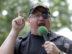 FILE - In this Sunday, June 25, 2017 file photo, Stewart Rhodes, founder of the Oath Keepers, speaks during a rally outside the White House in Washington. Rhodes has been arrested and charged with seditious conspiracy in the Jan. 6 attack on the U.S. Capitol. The Justice Department announced the charges against Rhodes on Thursday. (AP Photo/Susan Walsh, File)