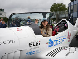 FILE - Belgian-British teenager Zara Rutherford waves from her Shark ultralight plane prior to take off at the Kortrijk-Wevelgem airfield in Wevelgem, Belgium, Aug. 18, 2021. Rutherford is set to land in Kortrijk, Belgium on Monday, Jan. 17, 2022, in the hopes of completing her trek around the world as the youngest woman ever, beating the mark of American aviator Shaesta Waiz, who was 30 when she set the previous benchmark. (AP Photo/Virginia Mayo, File)