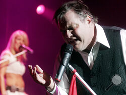 FILE - Meat Loaf performs at a concert in New York's Madison Square Garden, Wednesday, July 18, 2007. Meat Loaf, whose "Bat Out Of Hell" album is one of the all time bestsellers, has died, family said on Facebook, Friday, Jan. 21, 2022. (AP Photo/Andy Kropa, File)
