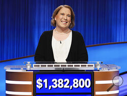 This image released by Sony Pictures Television shows contestant Amy Schneider on the set of "Jeopardy!" After 40 games, Schneider's winning streak has ended. (Casey Durkin/Sony Pictures Television via AP)