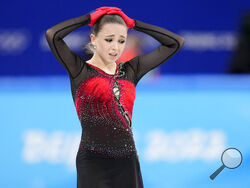 Kamila Valieva, of the Russian Olympic Committee, reacts after the women's team free skate program during the figure skating competition at the 2022 Winter Olympics, Monday, Feb. 7, 2022, in Beijing. (AP Photo/Natacha Pisarenko)