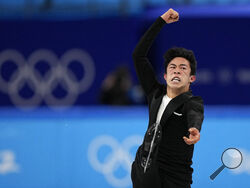Nathan Chen, of the United States, competes during the men's short program figure skating competition at the 2022 Winter Olympics, Tuesday, Feb. 8, 2022, in Beijing. (AP Photo/David J. Phillip)