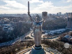 A view of Ukraine's the Motherland Monument in Kyiv Sunday, Feb. 13, 2022. In addition to the more than 100,000 ground troops that U.S. officials say Russia has assembled along Ukraine's eastern and southern borders, the Russians have deployed missile, air, naval and special operations forces, as well as supplies to sustain a war. (AP Photo/Efrem Lukatsky)