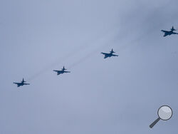 Fighter jets of the Russian and Belarusian air forces fly in a joint mission during the Union Courage-2022 Russia-Belarus military drills in Belarus, Thursday, Feb. 17, 2022. Russia has deployed troops to its ally Belarus for sweeping joint military drills that run through Sunday, fueling Western concerns that Moscow could use the exercise to attack Ukraine from the north. (AP Photo/Alexander Zemlianichenko Jr)